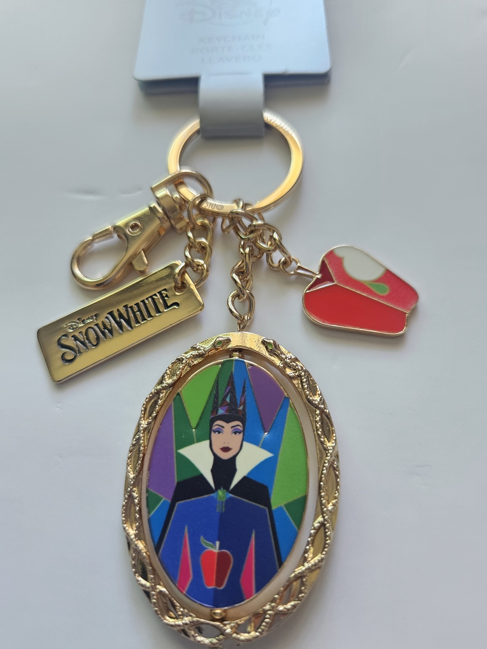 Disney Snow White Spinner Keychain, featuring a double-sided flipping pendant th